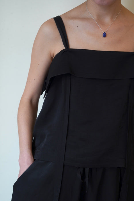 pelleq<br>travel convert bib